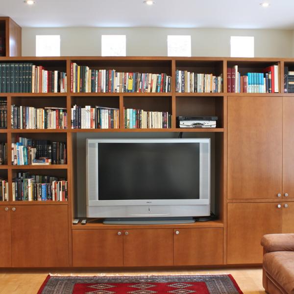 Contemporary family room wall unit in maple for a custom home.